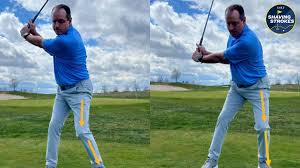 Golfer demonstrating proper downswing and weight shift technique — how to improve your golf swing without an instructor step by step.