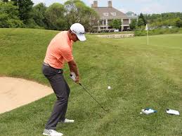 Ultimate Golf Mastery Pro Review golf swing training showing proper balance, posture, and accuracy technique during an on-course practice drill